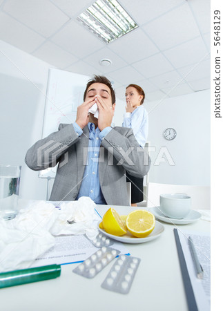 Man sneezing Man sneezing 5648129