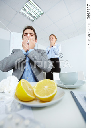 Man sneezing 5648157