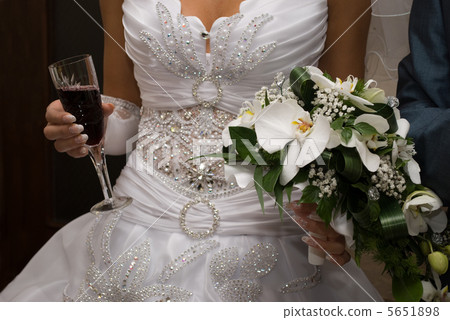Bride hold bouquet and wine Bride hold bouquet and wine 5651898