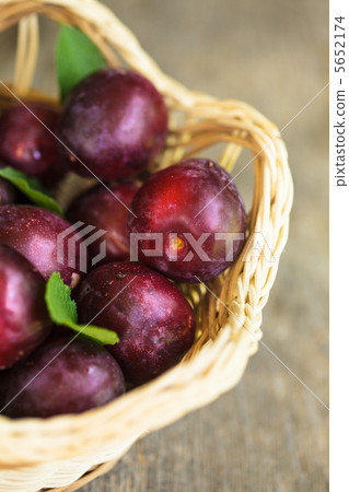 Plums on table Plums on table 5652174