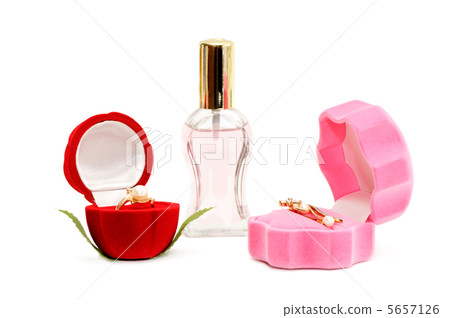 Gold ornaments and bottle of perfume Gold ornaments and bottle of perfume 5657126