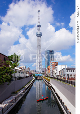 The Tokyo Sky Tree spreading the blue sky and the Kayak of the Northern River 5660750