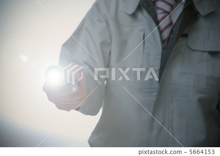 Workers illuminating with light Workers illuminating with light 5664153