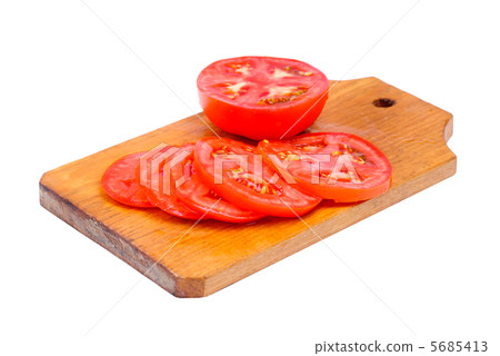whole and sliced fresh red tomatoes on  cutting board isolated on white background 5685413