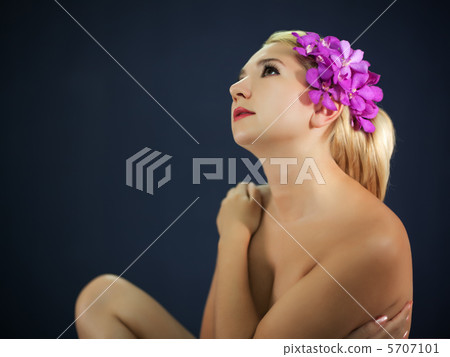 Woman with orchid 5707101