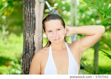 Woman taking a shower Woman taking a shower 5707342