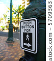 Signs for pedestrian pushbuttons in the American crosswalk 5709363