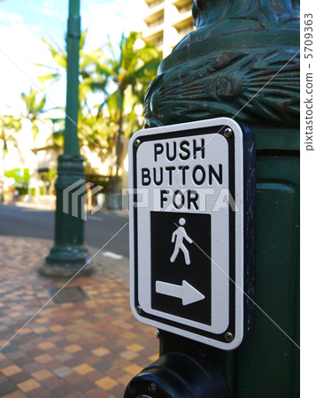 Signs for pedestrian pushbuttons in the American crosswalk 5709363