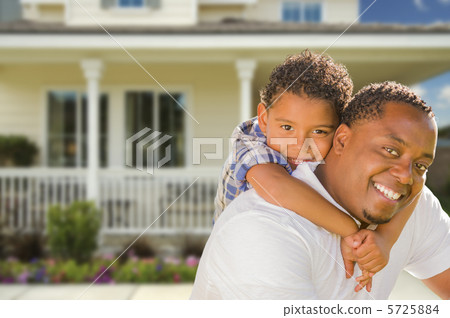 Mixed Race Father and Son In Front of House 5725884