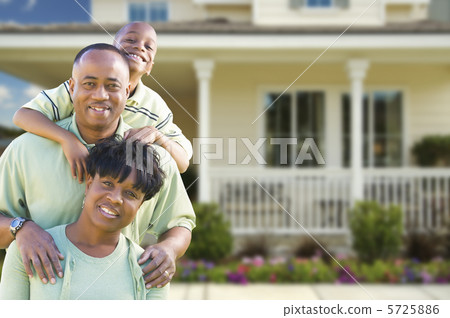 Attractive African American Family in Front of Home 5725886