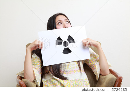 A woman holding a radiation mark A woman holding a radiation mark 5726285