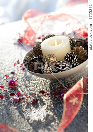 Candles and ornaments and ribbons 5735281