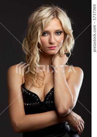 Beautiful and sexy woman in leather corset Beautiful and sexy woman in leather corset 5737369