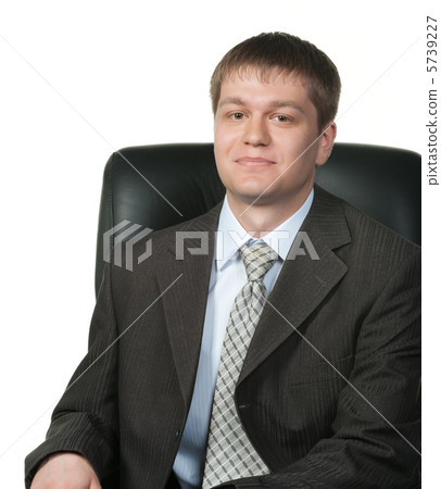 The young businessman in an armchair 5739227