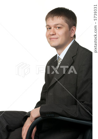 The young businessman in an armchair 5739331