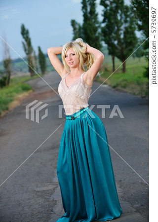 Portrait of a pretty woman standing on the road 5739697