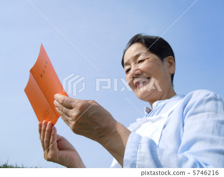 Senior woman sideways up in the pension notebook 5746216