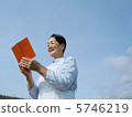 Senior woman looking into pension notebook 5746219