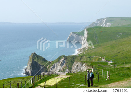 Dorset coastline in the southwestern part of England, characterized by white limestone cliffs in a row 5765391