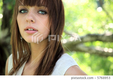 A foreign woman portrait taken under a tree 5768953
