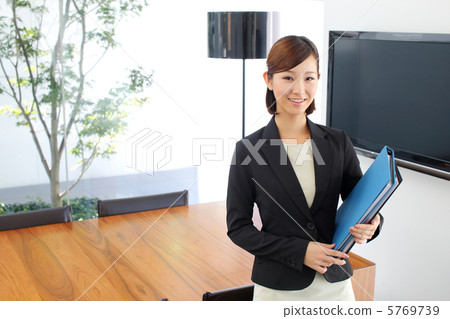 Business woman standing in the meeting room Business woman standing in the meeting room 5769739