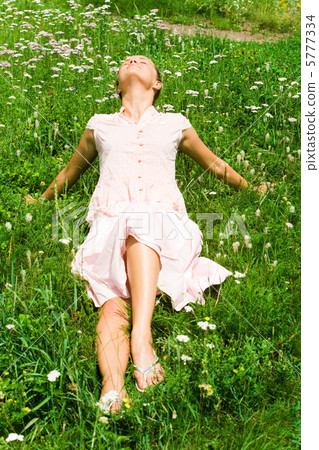 Lying on grass Lying on grass 5777334