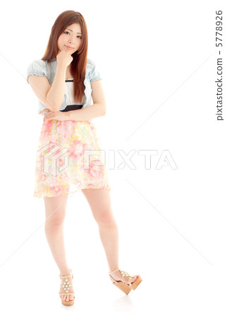 A woman dressed in a fresh spring / summer fashion 5778926