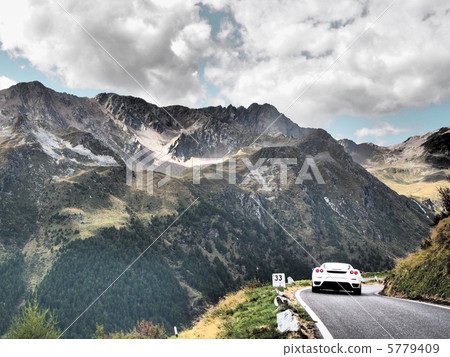 Drive the northern Italian Alps mountain path with a sports car 5779409