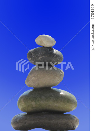 The stack of pebble stones in zen concept  on blue 5784369