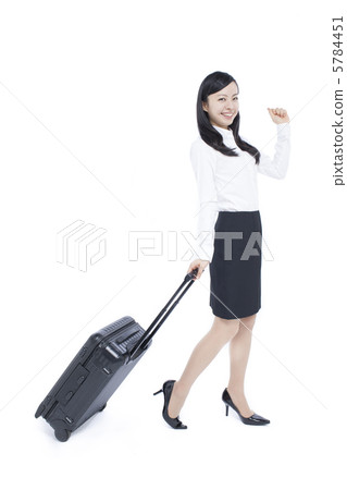 A woman with a suitcase A woman with a suitcase 5784451