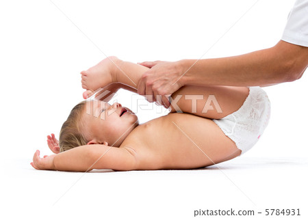 doctor massaging or doing gymnastics baby girl doctor massaging or doing gymnastics baby girl 5784931