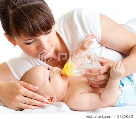 young mother feeding her adorable baby young mother feeding her adorable baby 5785028