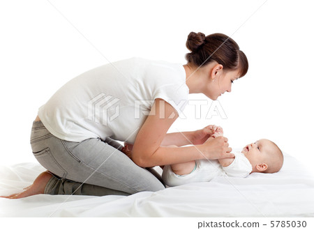 joyful mother playing with her baby infant joyful mother playing with her baby infant 5785030