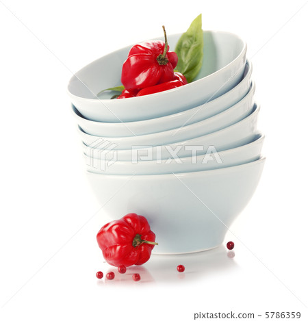Stack of bowls and red peppers Stack of bowls and red peppers 5786359