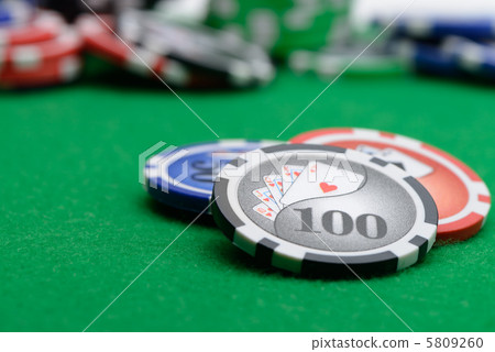 Gaming chips on the green cloth 5809260