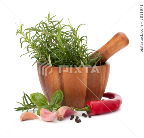 fresh flavoring herbs and spices in wooden mortar fresh flavoring herbs and spices in wooden mortar 5811971
