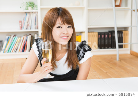 A woman drinking champagne A woman drinking champagne 5815854
