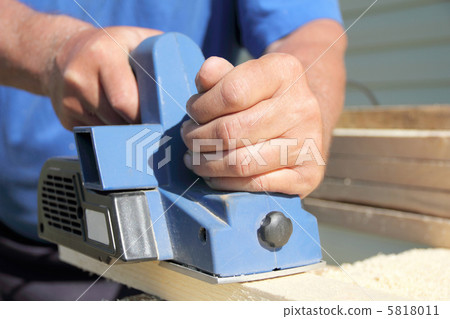 blue plane on a board and hands 5818011