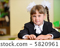 schoolchild with white bows and black suite 5820961