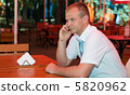 Young businessman speaks on a mobile phone 5820962