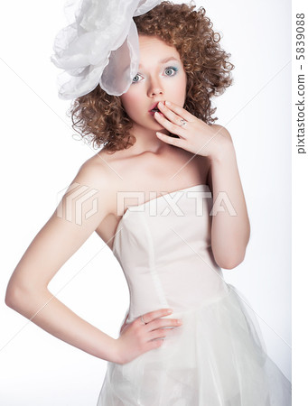 Lovely girl bride with white bow posing - series of photos 5839088