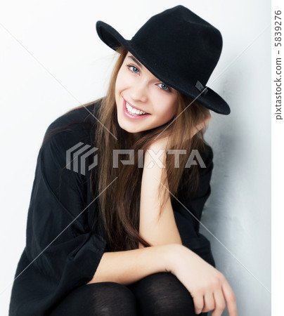 Cheerful beautiful girl in black clothes closeup Cheerful beautiful girl in black clothes closeup 5839276
