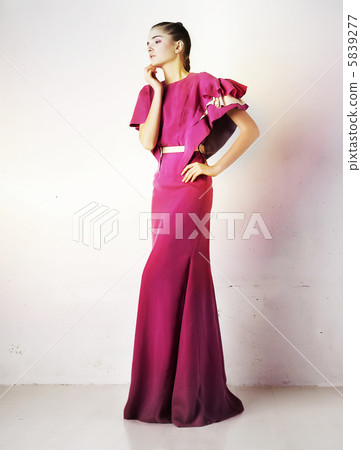 Pretty girl in fashion crimson dress studio shot Pretty girl in fashion crimson dress studio shot 5839277