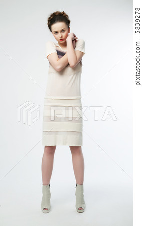 Beauty female in white contemporary dress posing Beauty female in white contemporary dress posing 5839278