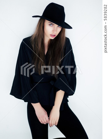 Stylish young female in fashion clothes posing Stylish young female in fashion clothes posing 5839282
