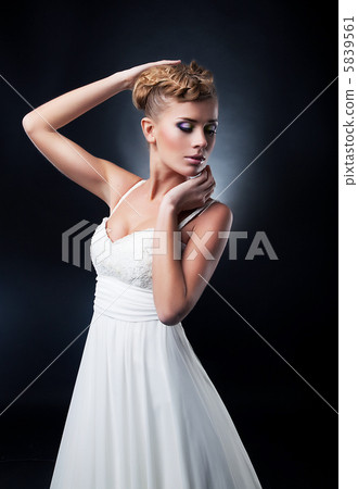 Portrait of romantic blonde young pretty bride. Studio shot Portrait of romantic blonde young pretty bride. Studio shot 5839561