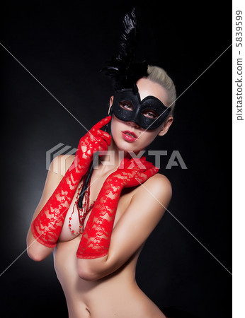 Masquerade - masked girl blonde in red gloves and black mask 5839599