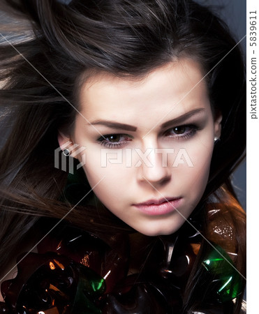 Closeup portrait of young woman beauty with waving hair Closeup portrait of young woman beauty with waving hair 5839611