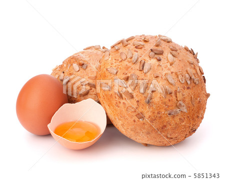 Bun with seeds and broken egg 5851343