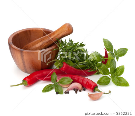 fresh flavoring herbs and spices in wooden mortar 5852221